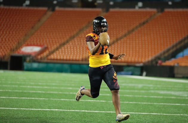 Kapolei QB Taulia Tagovailoa walks in untouched for a 1-yard TD to give Hawaii East a 12-7 lead over Hawaii West in the third quarter. Photo by Jamm Aquino/Star-Advertiser.