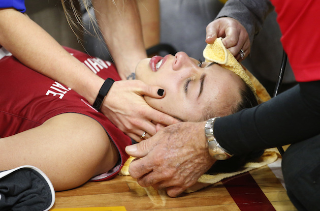 Washington State freshman guard Cameron Fernandez was tended to by medical staff after an injury in a game against Arizona State. Associated Press photo