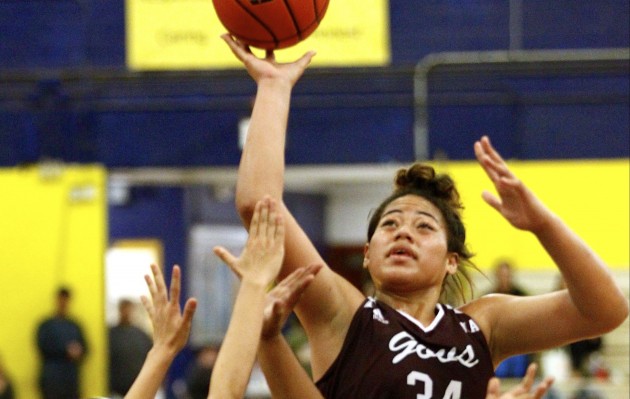 Farrington's Molimau Heimuli shot the ball over two Kaimuki defenders during the second half of the 2017 OIA Division I girls basketball championship game. Photo by Jamm Aquino/Star-Advertiser