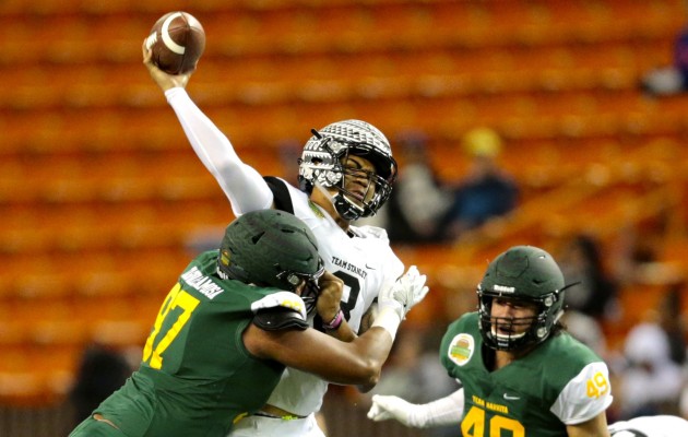This hit Kapolei defensive lineman Myron Tagovailoa-Amosa put on quarterback Alex Faniel in the Polynesian Bowl is legal and will still be legal moving forward. Photo by Jamm Aquino/Star-Advertiser.