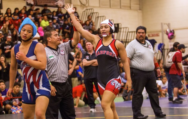 The referee lifts the arm of Angela Peralta after the Radford wrestler won her fourth OIA individual championship Saturday at Leilehua. You can watch the video of her winning pin, along with video of five other OIA finals matches, here. Dennis Oda / Honolulu Star-Advertiser.