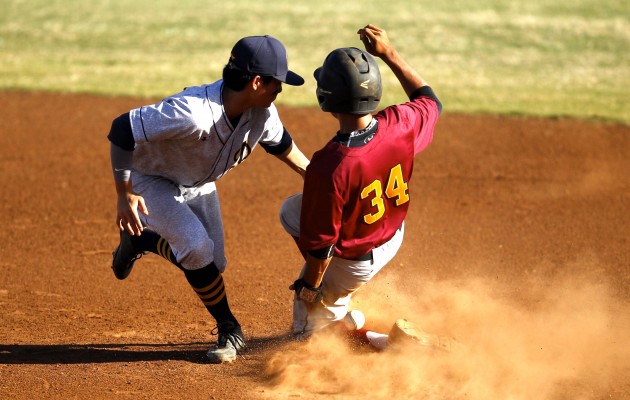 Maryknoll's Shane Himeda slid in safely at second for a stolen base against Punahou at Hans L'Orange Park. Photo by Jamm Aquino/Star-Advertiser.