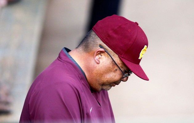Maryknoll head coach Eric Kadooka looks down while standing in the dugout during the sixth inning of an ILH baseball game against Punahou on Tuesday, March 28, 2017 at Hans L'Orange Park. Jamm Aquino/Star-Advertiser (Mar. 28, 2017)