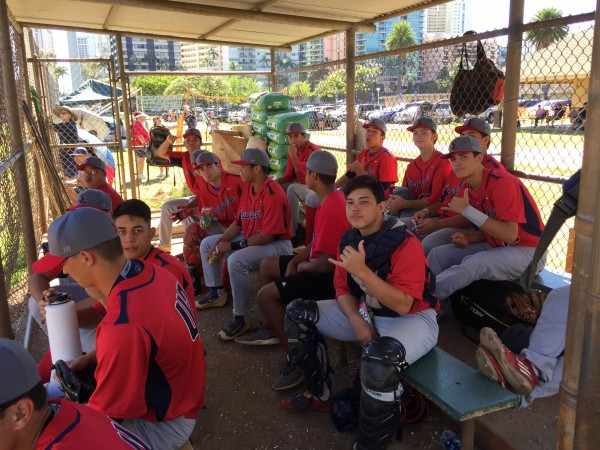 Saint Louis awaited the start of the game in the dugout, occasionally stepping outside. 