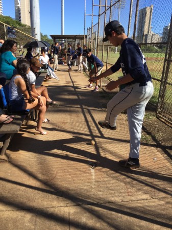 Kamehameha players found ways to kill time during the 81-minute delay. 