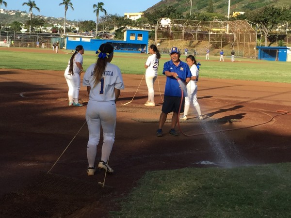 Coach Mitch Matsumoto and the Kaiser Cougars prep the field after a 10-9 win over Moanalua. Paul Honda/Star-Advertiser