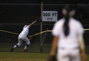 Taylor Au makes a grab of a would-be home run at Central Oahu Regional Park in the fifth inning of a 10-0 win over Nanakuli on Tuesday. Jamm Aquino / Honolulu Star-Advertiser.