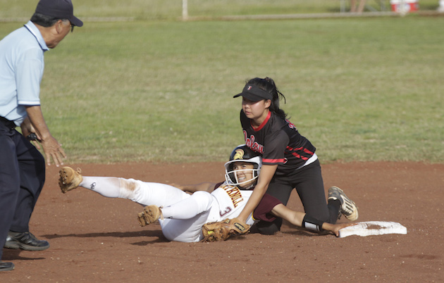'Iolani shortstop Ashlyn Okamoto made an out at second base tagging Maryknoll's Logan Carlos in a 2016 game. Star-Advertiser photo.