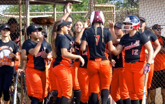 Cieana Curran was greeted by teammates after hitting a home run in the Sabers' OIA opener. Photo by Craig T. Kojima/Star-Advertiser.