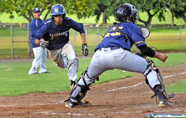 Kamehameha's Kawai Takemura eyed the plate as he tried to beat the tag of Punahou catcher Ryan Nishi in a game last week. Photo by Bruce Asato/Star-Advertiser.