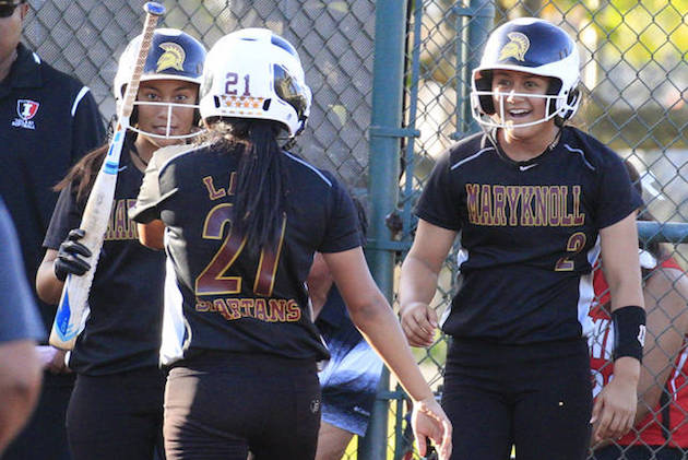 Maryknoll’s Kiana Arcayena (34) and Maia McNicoll (2) greeted teammate Kamalei Labasan after she was brought in with a two-run RBI double by Baylie Kahele in the sixth inning of a game against 'Iolani. Photo by Cindy Ellen Russell/Star-Advertiser.