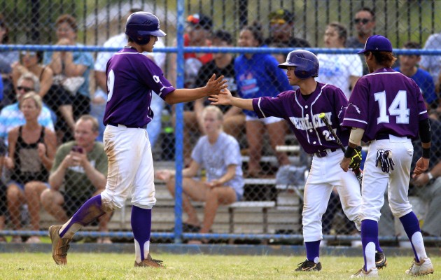 Pearl City's Cade Halemanu, left, slapped hands with teammate Jensen Kaya (27) after he scored on an RBI single by Sam Prentice (not pictured) in the sixth inning of a 3-2, 10-inning OIA quarterfinal loss to Kailua. Cindy Ellen Russell / Honolulu Star-Advertiser.