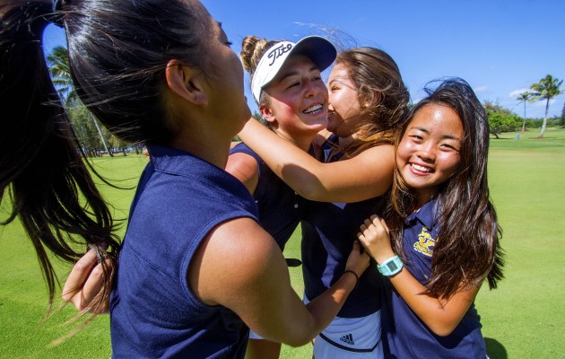 Kaiser's Malia Nam, middle, was hugged by Keila Baladad, left, Sasra Keppel and Elisa Nishimoto, far right, after winning the girls individual OIA title at Turtle Bay on Tuesday. Photo by Dennis Oda/Star-Advertiser.