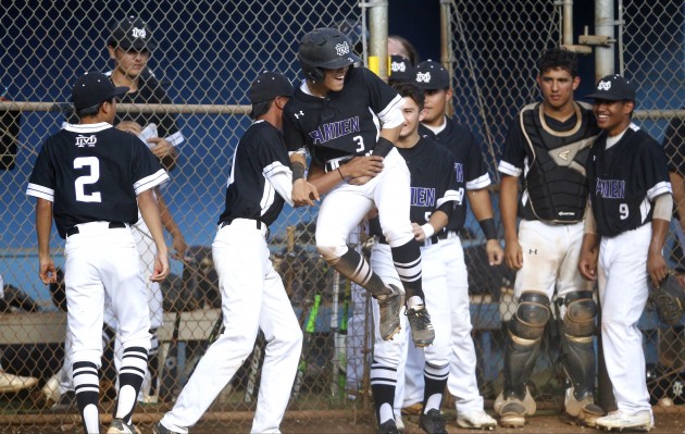 Damien infielder Jordan Donahue was mobbed by teammates after tying the game at 5 during the fourth inning of an ILH division II playoff baseball game against St. Francis. Photo by Jamm Aquino/Star-Advertiser
