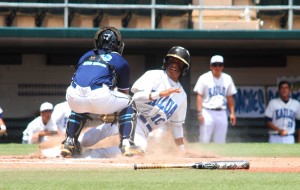 Kailua's Matthew Kaleohi was thrown out at home to end the bottom of the first inning. Photo by Jerry Campany/Star-Advertiser.