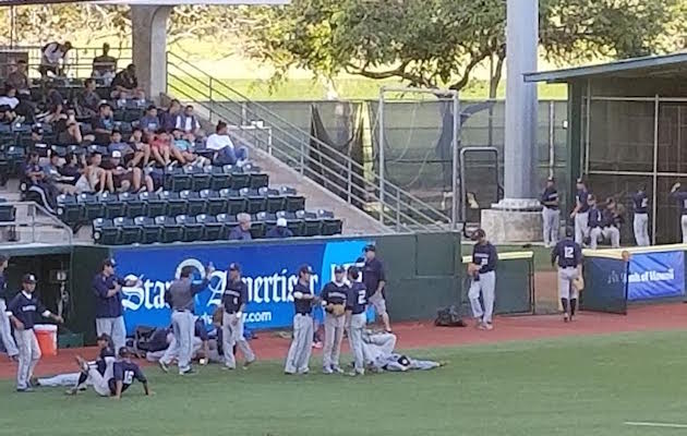 Kamehameha was on the field more than an hour before its scheduled first pitch against Kalani. Photo by Billy Hull/Star-Advertiser.