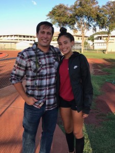 Campbell hurdles coach Mike Hanakahi after losing the bet and the beard to Sabers athlete Leilani Leopard. Photo courtesy of Guy Leopard.