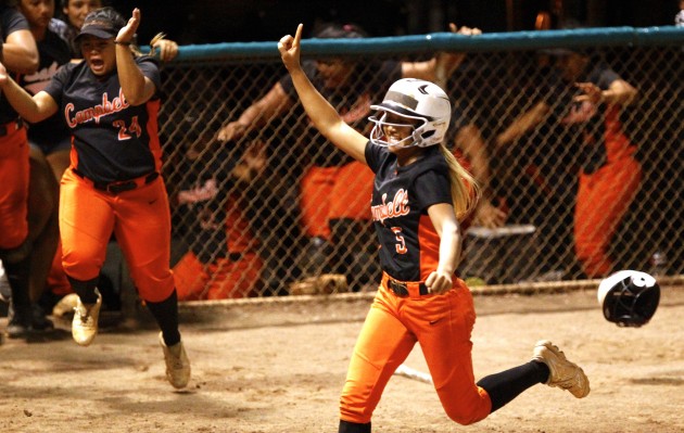 Campbell shortstop Alesia Ranches raised her hand while scoring the winning run during the seventh inning of a 5-4 win over Pearl City in the state softball semifinals. Photo by Jamm Aquino/Star-Advertiser.